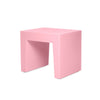 White concrete seating by Fatboy, modern and minimalist outdoor seating with a smooth, rounded design.