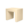 White concrete seat by Fatboy, modern outdoor seating with a smooth, minimalist design and sturdy construction.