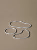 Set of three Ferm Living Pond trivets made of aluminum, decorative accessories for protecting surfaces from hot dishes.