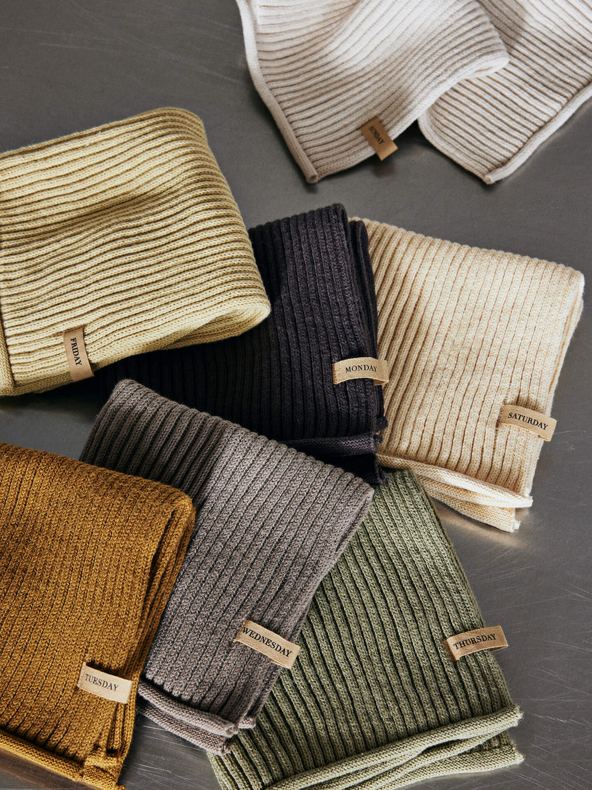 Set of 7 Ferm Living Day Cloths, soft fabric accessories with calm, neutral tones, ideal for daily use and decorative purposes.