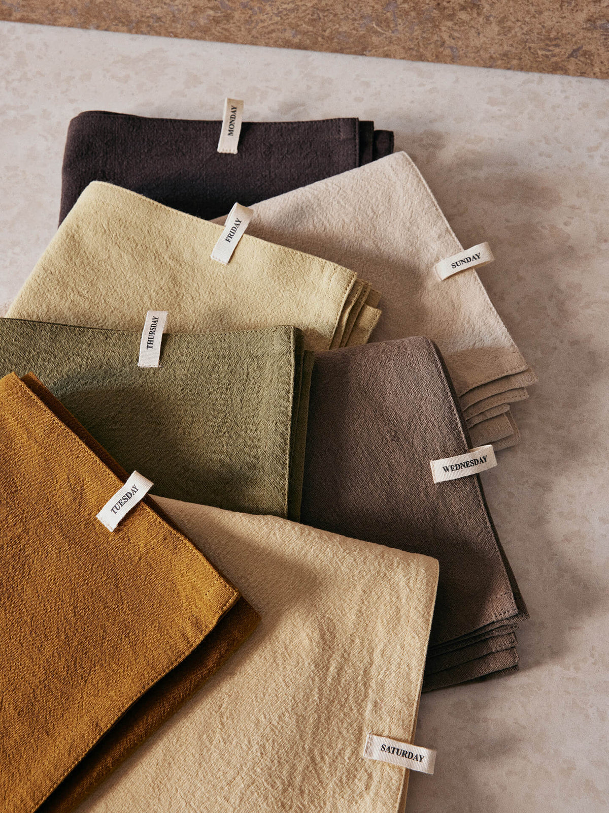 Set of 7 Ferm Living Day Tea Towels featuring calm, minimalist designs, perfect for kitchen accessories and everyday use.