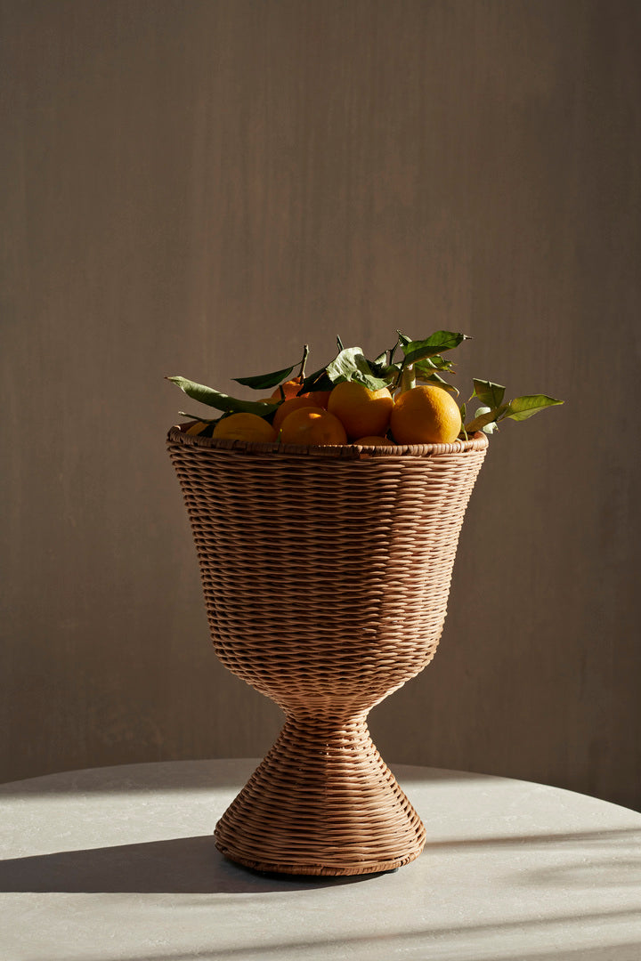 Ferm Living Agnes Plant Stand Low, a stylish black metal accessory for supporting indoor plants.