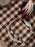 Ferm Living Bothy Check Table Cloth with red and white plaid pattern, designed as a stylish table accessory.