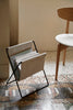 Ferm Living Herman magazine stand accessory featuring a modern, black metal design for organizing magazines and newspapers.