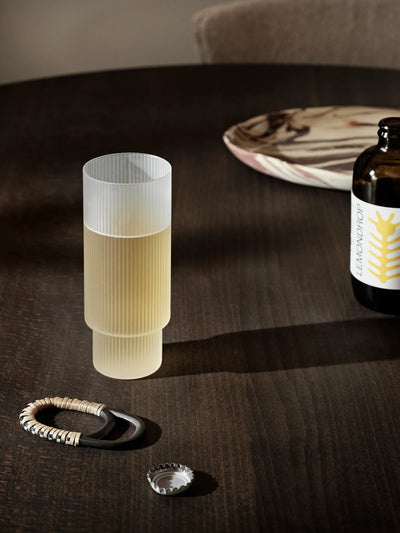 Ferm Living Ripple Long Drink Glasses with frosted, textured design, perfect for serving beverages in a stylish accessories set.