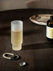 Ferm Living Ripple Long Drink Glasses with frosted, textured design, perfect for serving beverages in a stylish accessories set.
