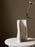 Large off-white Moire Vase by Ferm Living, a stylish decorative accessory with a textured pattern.