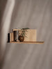 Ferm Living Stagger Shelf accessory with geometric design, mounted on a wall, showcasing modern home decor style.