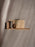 Ferm Living Stagger Shelf accessory with geometric design, mounted on a wall, showcasing modern home decor style.