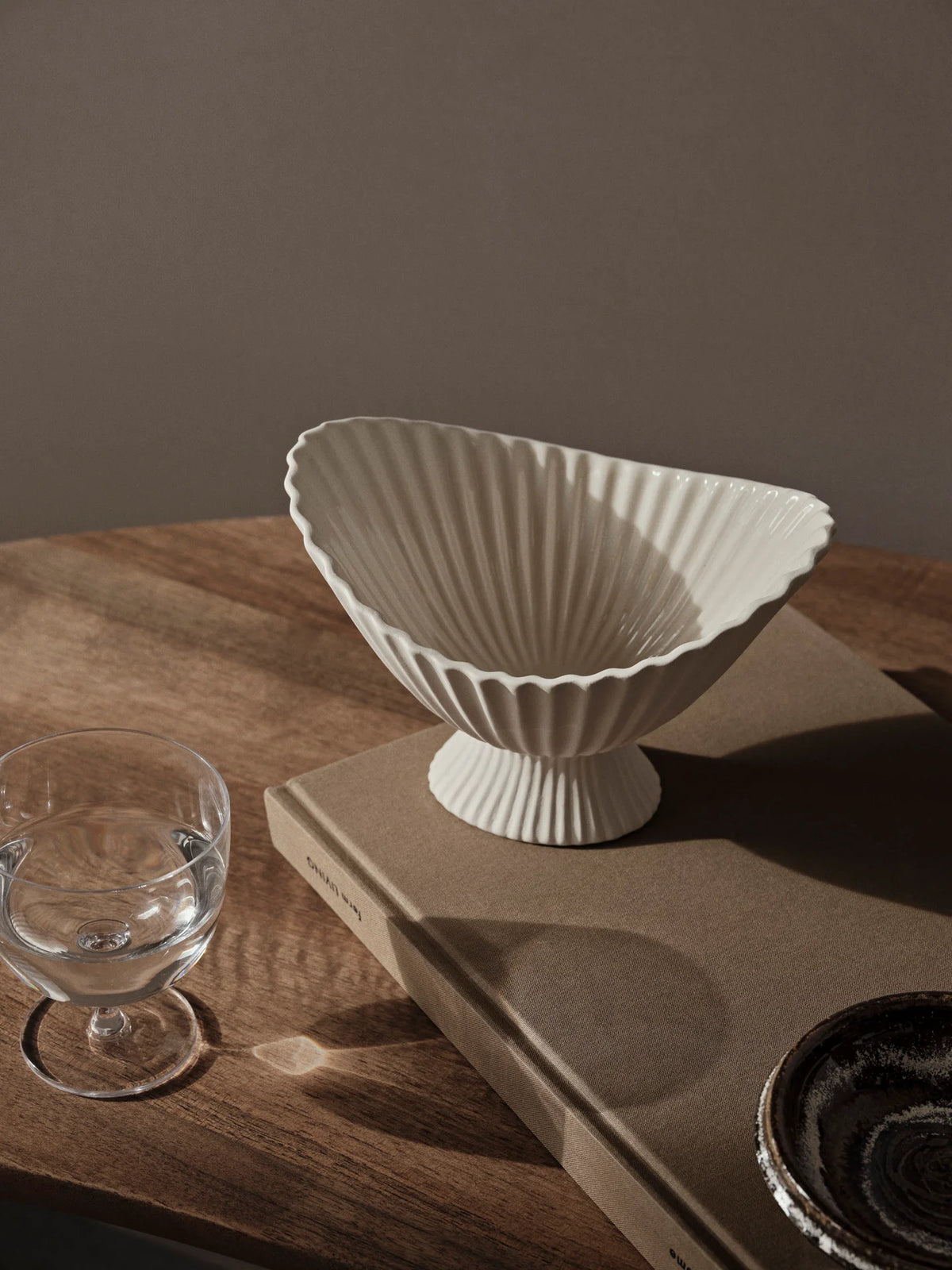 Ferm Living Fountain Bowl in small size, a stylish ceramic accessory with a smooth, rounded design for decorative use.