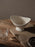 Ferm Living Fountain Bowl in small size, a stylish ceramic accessory with a smooth, rounded design for decorative use.