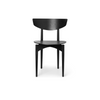 Ferm Living Herman Dining Chair in black wood with a sleek, modern design and curved backrest for comfortable seating.