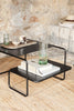 Black Ferm Living Level Coffee Table with sleek, modern design and round tabletop, perfect for contemporary living spaces.