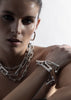 Silver plated Relier bracelet by Skultuna with sleek, minimalist design, displayed on a neutral background.