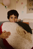 Kids' Apple-shaped floor cushion by Lorena Canals, soft fabric with colorful apple design for children's room decor.