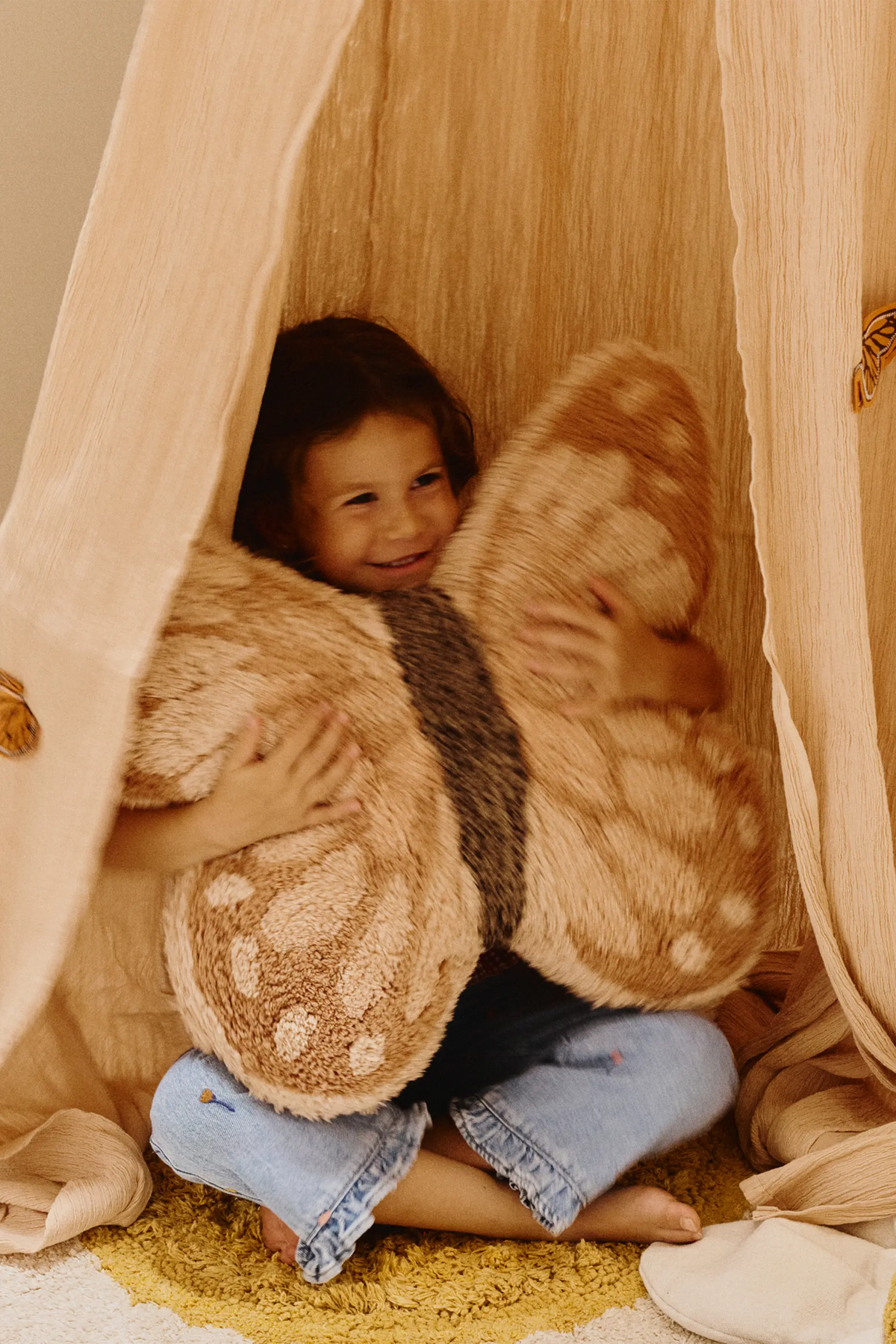 Kids butterfly floor cushion by Lorena Canals featuring colorful butterfly patterns and soft fabric for cozy seating.