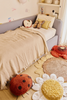 Kids' floor cushion featuring Maria the ladybug design by Lorena Canals, soft fabric with bright red and black ladybug pattern.