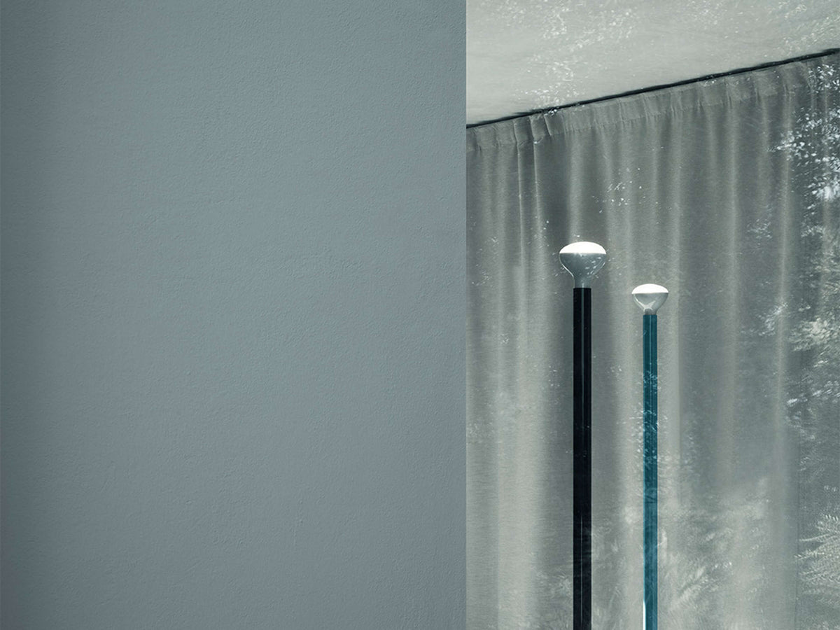 Anthracite Luminator by Flos lighting fixture with sleek, modern design and adjustable arm for focused illumination.