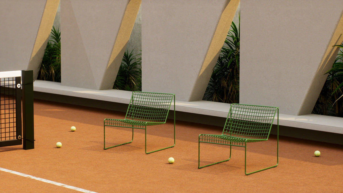 Fred Lounge Chair by Bend Goods, a stylish seating piece with a sleek metal frame and comfortable cushioned seat.