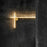 Flos Coordinates Wall lighting fixture in champagne finish, showcasing sleek modern design with illuminated diffuser.