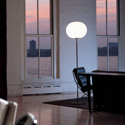 Black Glo-Ball Floor lamp by Flos, modern lighting fixture with a sleek, rounded design and adjustable arm for ambient illumination.