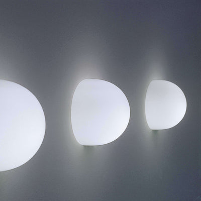 Modern Glo-Ball Wall lighting fixture by Flos, sleek frosted glass globe mounted on a wall bracket for ambient illumination