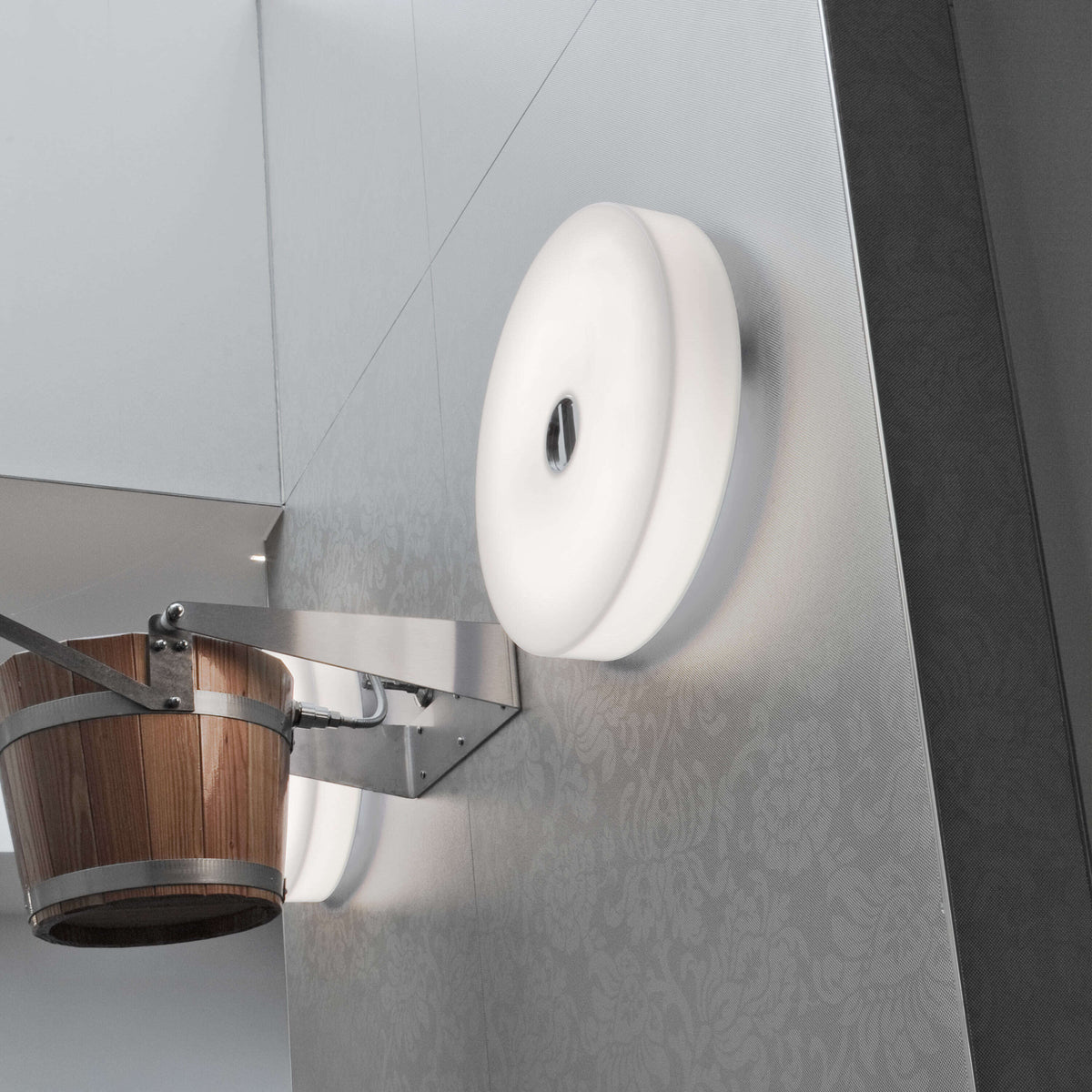 Mini Button by Flos lighting fixture with a sleek, modern design and compact shape, ideal for contemporary interior decor.