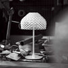 White Tatou Table Lamp by Flos, modern lighting with smooth, rounded design and a sleek white finish.