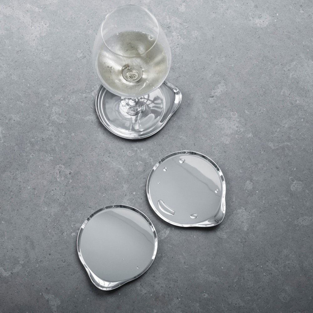 Set of Georg Jensen wine and bar coasters, stylish accessories with elegant design, perfect for protecting surfaces during drinks.