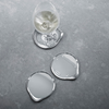 Set of Georg Jensen wine and bar coasters, stylish accessories with elegant design, perfect for protecting surfaces during drinks.
