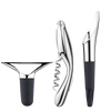 Georg Jensen wine accessories including a corkscrew, stopper, and pourer, made of sleek metal with elegant design.
