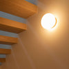 White Glo-Ball Ceiling and Wall Light by Flos showing a sleek, modern design mounted on a wall and ceiling.