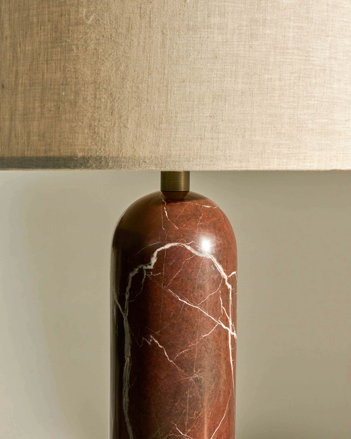 Close-up of Gubi Gravity Table Lamp showcasing its sleek, modern lighting design and smooth metallic finish.