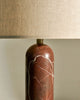 Close-up of Gubi Gravity Table Lamp showcasing its sleek, modern lighting design and smooth metallic finish.