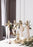 Skultuna Mistel candleholder accessory with a sleek metal design, displayed on a modern surface in a well-lit setting.