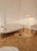Gubi Pedrera Coffee Table with chrome frame and smoke-colored structured glass top, modern design for living spaces.