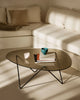 Gubi Pedrera coffee table with chrome frame and smoke-colored structured glass top, modern and stylish living room centerpiece.