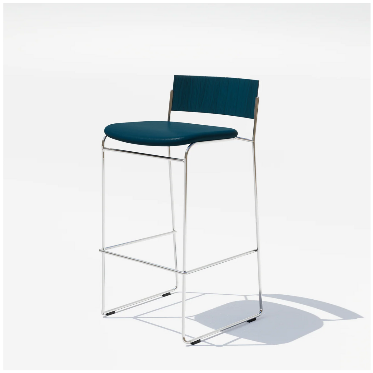 Hinoki Barstool by Bend Goods featuring a sleek, modern seating design with a chrome finish and wooden accents.