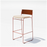 Hinoki Barstool by Bend Goods, modern seating with a sleek design, featuring a wooden seat and metal legs.