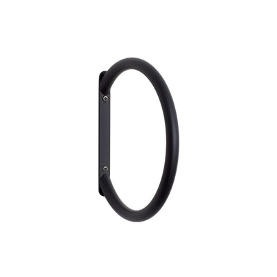 Black Hübsch towel ring accessory mounted on a wall for hanging towels, modern bathroom decor.