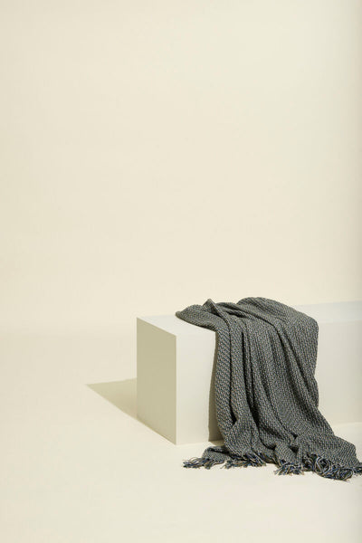 Hübsch Vista throw blanket displayed as a cozy accessory with soft fabric and stylish design on a neutral background.