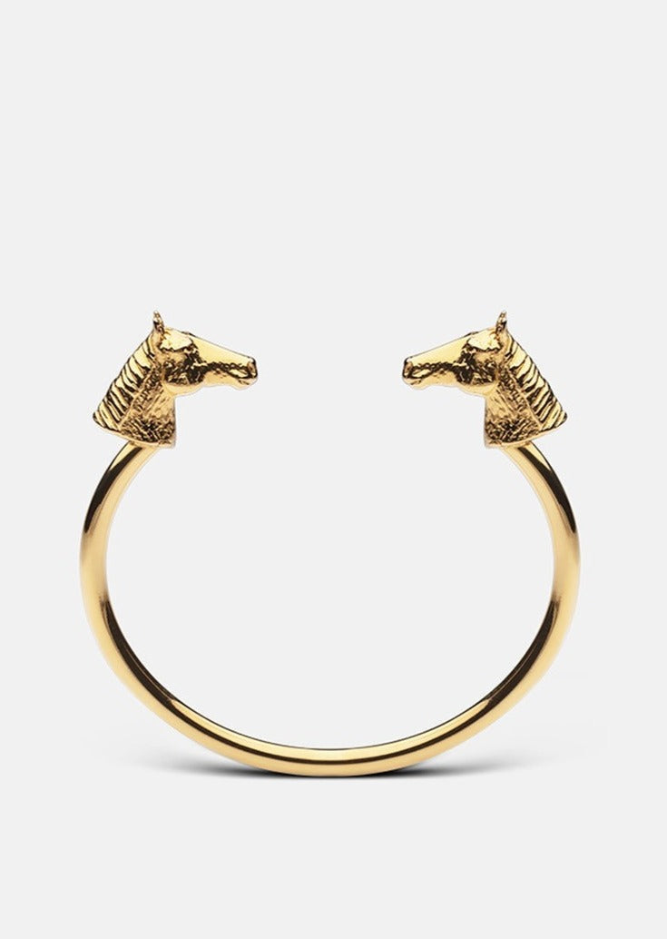 Gold plated GTG Horse Cuff by Skultuna, a stylish accessories bracelet with a detailed horse design.