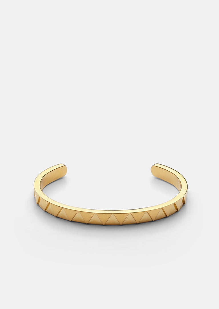 Gold plated Skultuna GTG Cuff accessory featuring sleek, modern design in a close-up view.