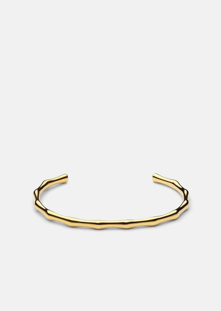 Gold plated Bambou Cuff bracelet by Skultuna, featuring sleek bamboo-inspired design and elegant accessory style.