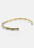 Gold plated Bambou cuff bracelet by Skultuna, featuring a sleek bamboo-inspired design in a stylish accessories image.
