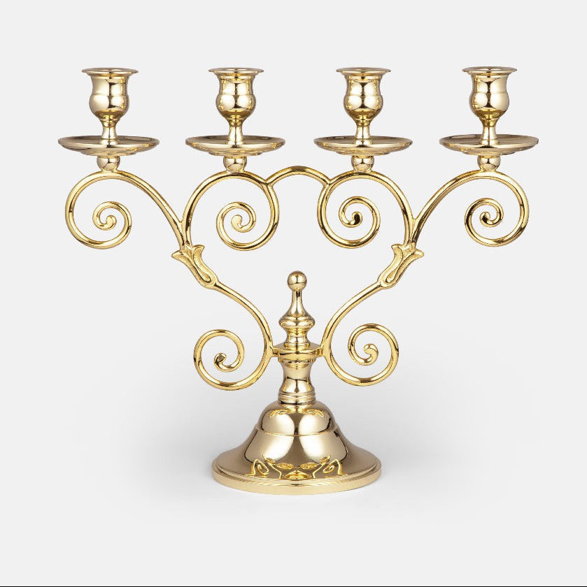 Elegant Mistel candleholder by Skultuna displayed on a wooden surface, showcasing its sleek metallic design and minimalist style.