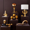Brass giant horn object accessory by Jonathan Adler, featuring a sleek, artistic design perfect for modern home decor.