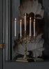 Elegant Skultuna candelabra accessory with multiple candle holders, crafted in polished metal for a sophisticated look.