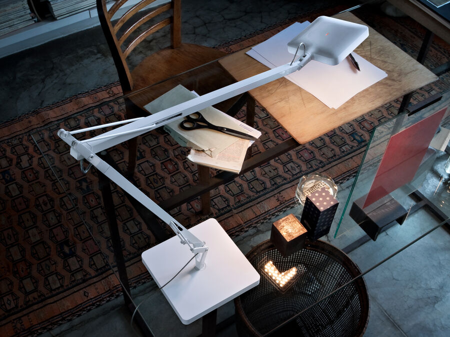 White Kelvin LED table lamp by Flos with sleek base design, featuring a modern lighting fixture by Citterio and Nguyen.