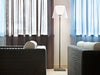 Transparent KTribe Floor lamp by Flos with sleek, modern design and star-shaped base, illuminated in a contemporary lighting setup.